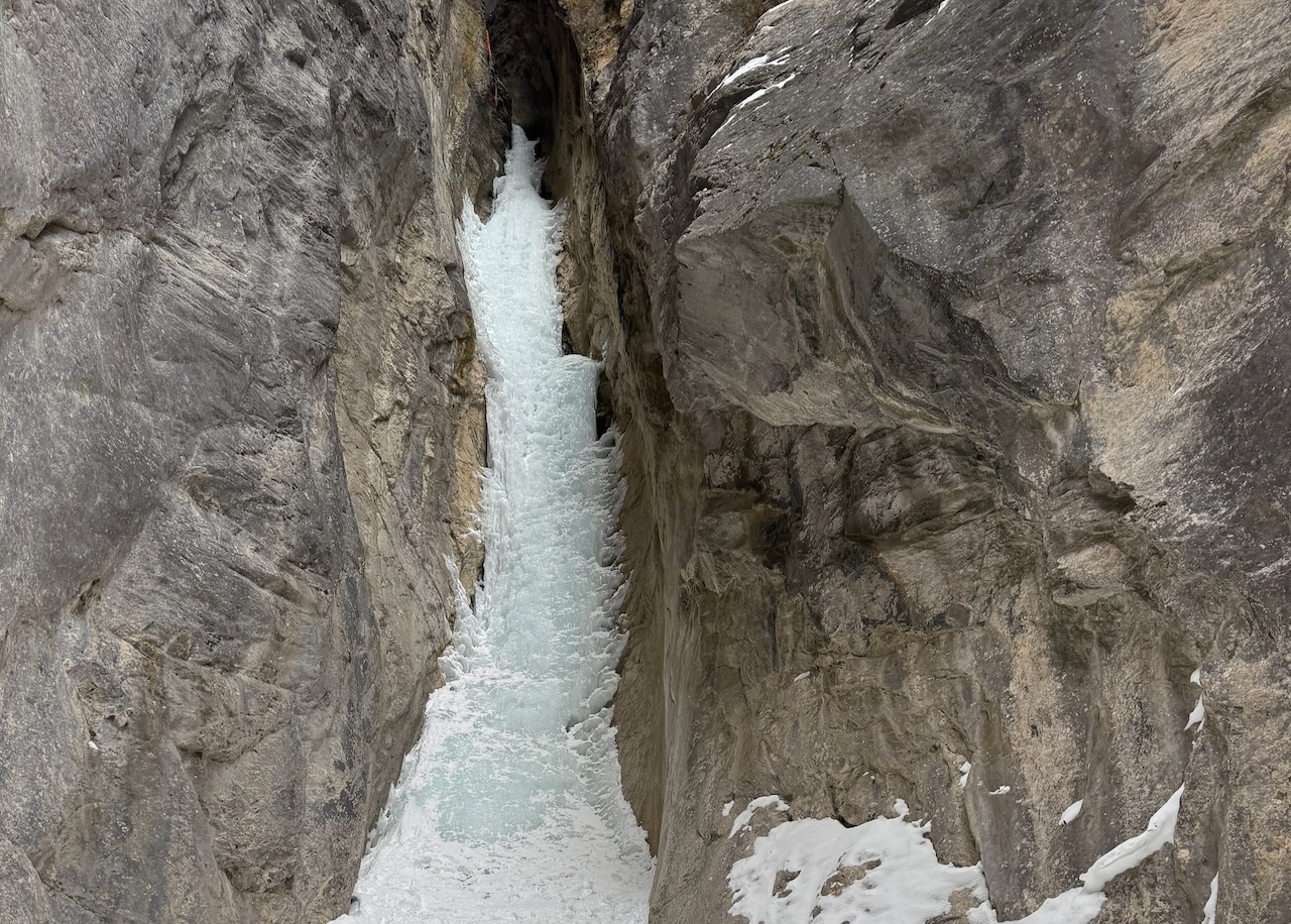 a narrow strip of ice fills a canyon